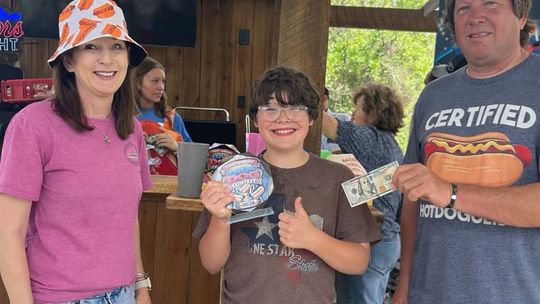 Hunter Finishes 12 Hot Dogs to Win 'Dam Dog Showdown'