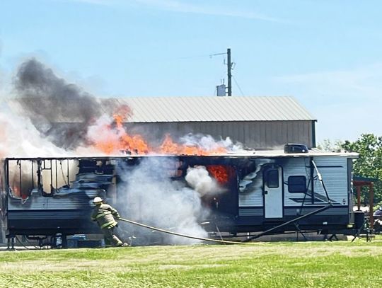 Camper Blaze Across From School