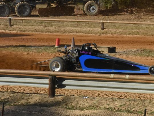 Driven to Win: The Women Throwing Sand at the Track