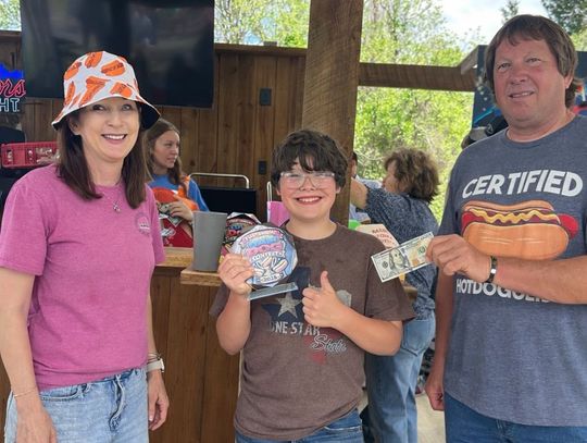 Hunter Finishes 12 Hot Dogs to Win 'Dam Dog Showdown'