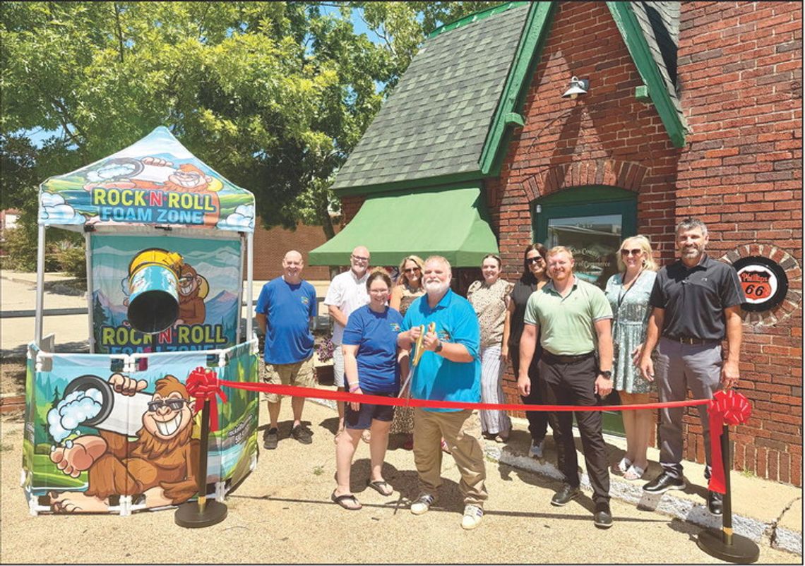 Members of the Atoka Area Chamber of Commerce gather alongside owner Steve Turrentine