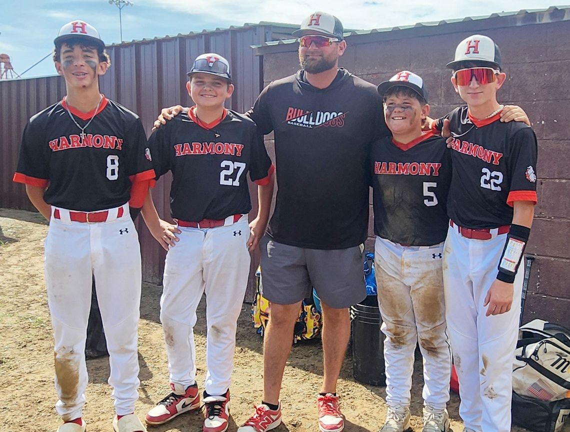 The eighth-grade members of the Harmony team pose with their coach after competing in their final Coleman Festival on September 19th